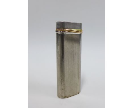 Cartier Paris lighter, the white metal case with a yellow metal band, stamped makers mark and number 09734, 7cm