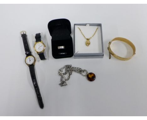 Christian Dior gilt metal pendant and chain, gold plated stiff hinged bangle, two lady's wrist watches, silver ring and neckl