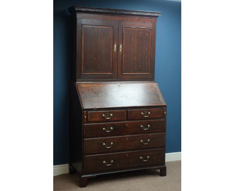 18th century oak fall front bureau bookcase, fitted interior, two short and three long drawers, raised bookcase enclosed by t
