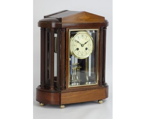 Edwardian mahogany four glass portico clock with floral enamel porcelain dial, twin train movement with faux mercury pendulum