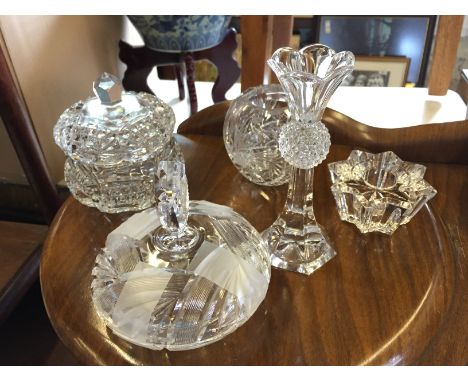 A selection of good quality crystal including two powder bowls, a candle stick, a tea light and a poesy vase.