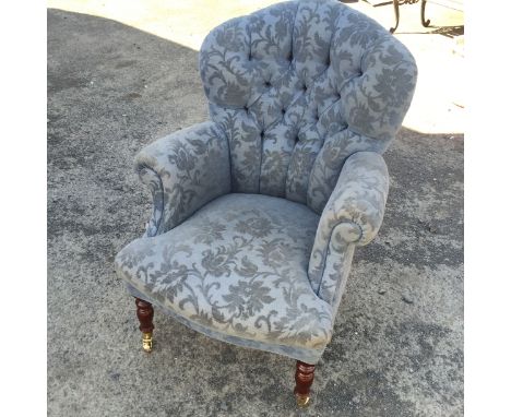A button backed armchair.