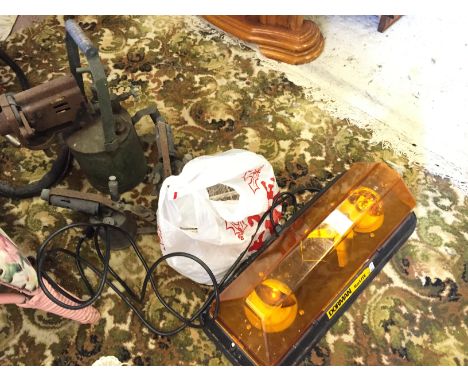 A hazzard light and a selection of blow lamps.
