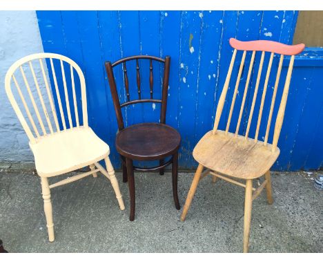 Three chairs one being Ercol.