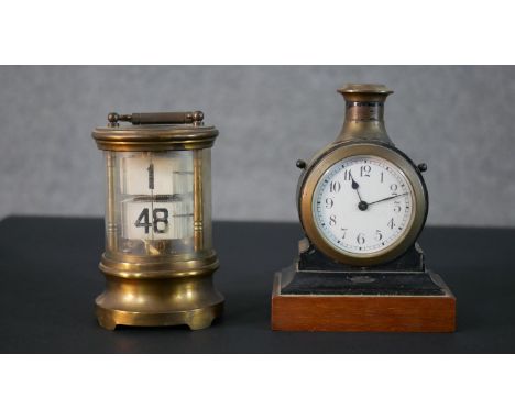 A Victorian ebonised and brass clock/candle stick along with a wind up ticket clock. H.16 W.11 D.7.5cm (largest) 