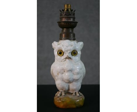 A late 19th  Continental porcelain glass eyed owl oil lamp, stamped Boler Freres, Paris. H.27 W.8 D.9cm 