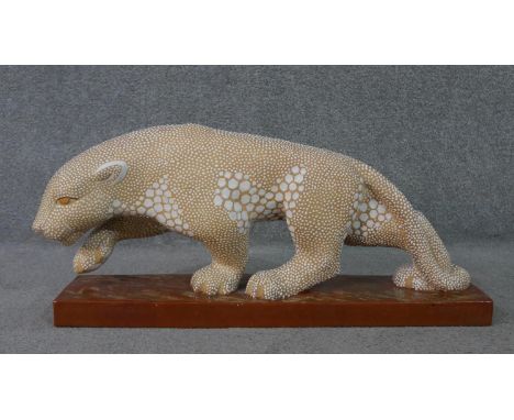 A large Art Deco glazed spotted ceramic panther sculpture, signed E. Pierre for Atelier Primavera. Impressed stamp to base. H