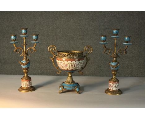 Two brass and hand painted ceramic candelabras and a twin handled bowl. Makers mark to the base. H.42cm. 