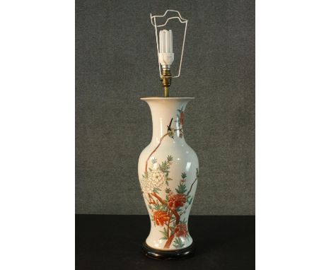 A Chinese hand painted ceramic vase converted into a table lamp. Decorated with chrysanthemums and birds, mounted on a hardwo