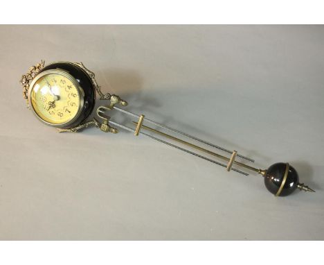 A 20th century bubble clock with ebonised globe pendulum.  H.49cm. 