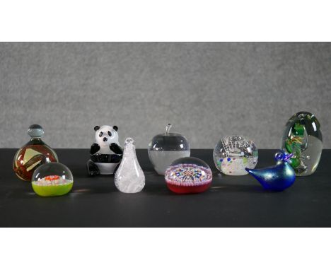 A collection of nine lamp work glass paperweights by various makers, including Langham, Heron and Glass-Rubs. H.12 W.8cm (lar
