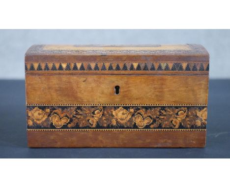 A 19th century lockable Tunbridge ware tea caddy, the domed top lid with a central castle motif and the sides with floral rib