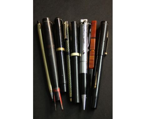 A collection of eight vintage fountain and ballpoint pens, including a novelty Ronson lighter pen, a gold plated Cross pen an