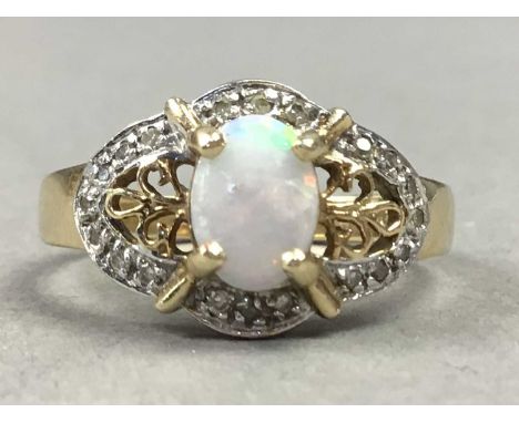 NINE CARAT GOLD OPAL AND DIAMOND RINGSome small chips and scratches present to opal, ring size is an N