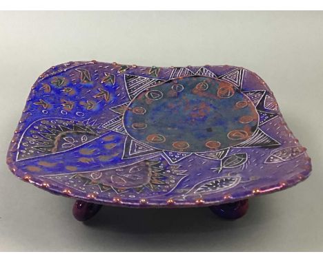 DIANE MCCORMICK POTTERY SQUARE COMPORT,raised on four scroll feet, 22cm wide, along with a shaped circular dish of similar de