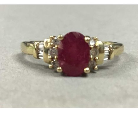 NINE CARAT GOLD RUBY AND DAMOND RING