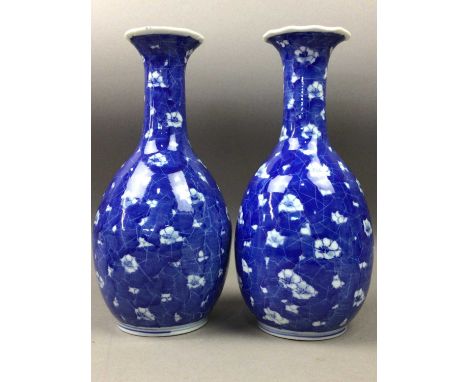 PAIR OF CHINESE BLUE AND WHITE VASES,decorated with prunus, 27cm high, along with a Japanese vase, small ceramic figure and t