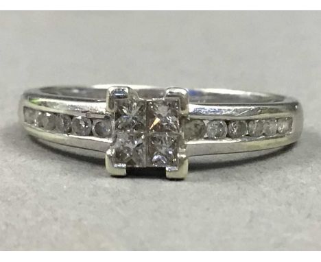 NINE CARAT WHITE GOLD DIAMOND SET RING