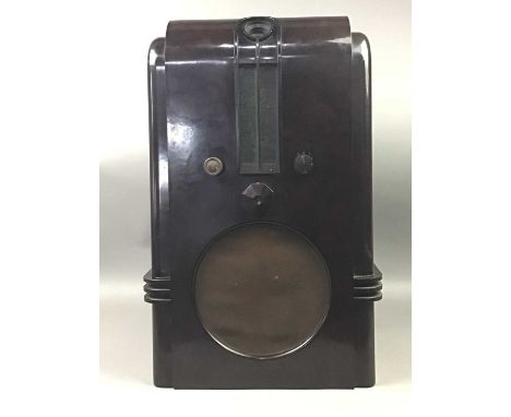 EKCO TYPE AC97 WIRELESS RECEIVER,'The Robot' 1936, the tall brown bakelite case with central 'magic eye' tuning and vertical 