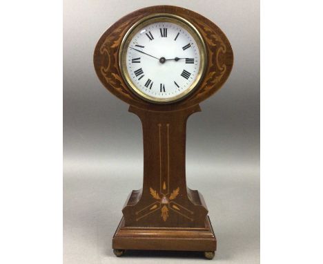 EDWARDIAN MANTEL CLOCK,contained in a mahogany inlaid case of Art Nouveau design, on four brass ball feet, 28cm highAdditiona