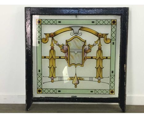LATE 19TH CENTURY STAINED AND PAINTED GLASS PANEL,with a central arch motif flanked by husk festoons within a green border, i