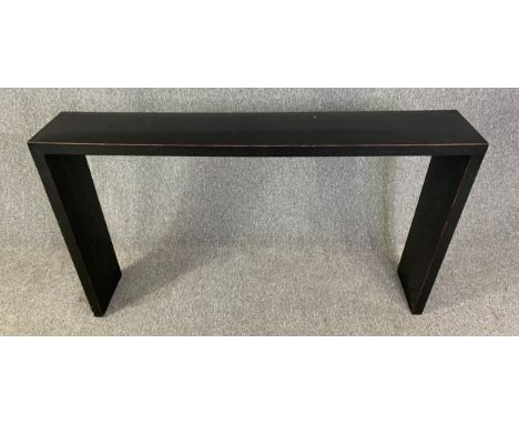 A contemporary lacquered console table. H.86 W.150 D.28cm
