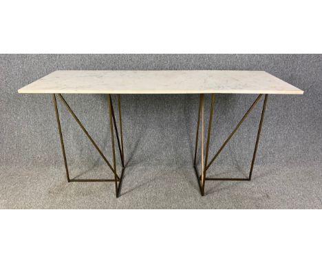 A contemporary marble topped console table on twin pedestal metal base. (Repair to marble as seen). H.78 W.153 D.59cm