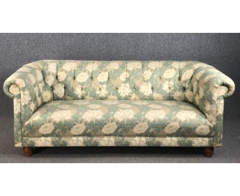 A Chesterfield sofa in deep buttoned William Morris style upholstery. W.192 H.75 D.90cm.