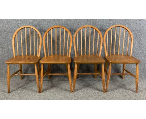 A set of four mid century Ercol low Windsor dining chairs in beech and elm. H.82cm (each)