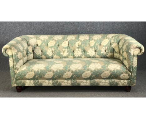 A Chesterfield sofa in deep buttoned William Morris style upholstery. W.192 H.75 D.90cm.