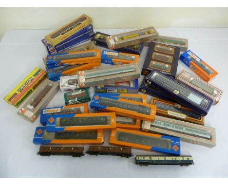A quantity of HO gauge model railway rolling stock and coaches in original packaging to include Roco, Lima, Liliput, Jouef, P