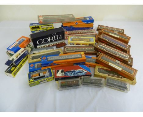 A quantity of HO gauge model railway rolling stock and coaches in original packaging to include Roco, Lima, Liliput, Jouef, P