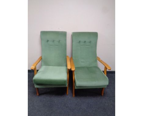A pair of beech framed fireside chairs in green dralon and a lamp table 