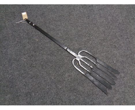 A large cast iron eel fork 