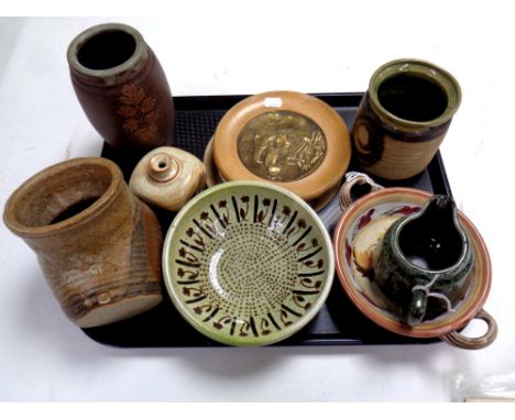A tray of seven pieces of 20th century Scandinavian pottery, brass plaque of a ship and a ceramic/wood teapot stand 