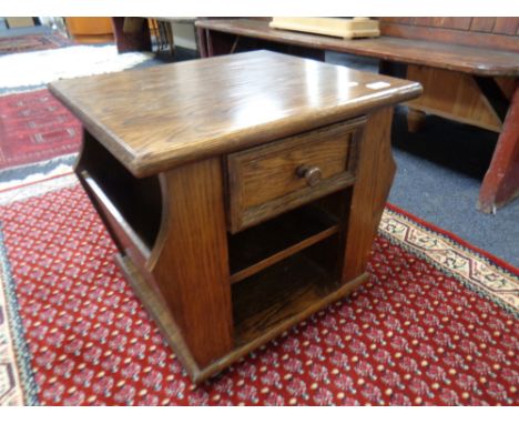 A magazine lamp table fitted a drawer in an oak finish  