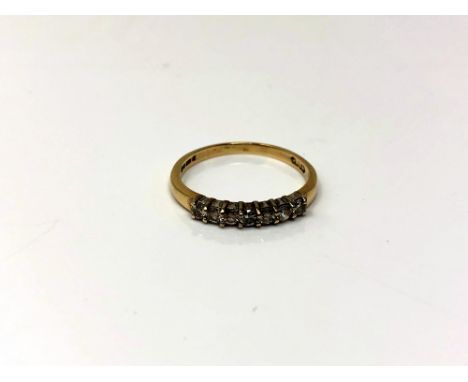 A 9ct gold diamond half eternity ring, 1.2 grams, size K/L  