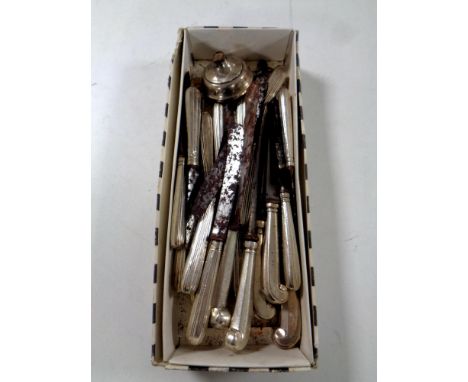 Twenty silver-handled knives together with a further weighted silver candlestick base (a/f). 