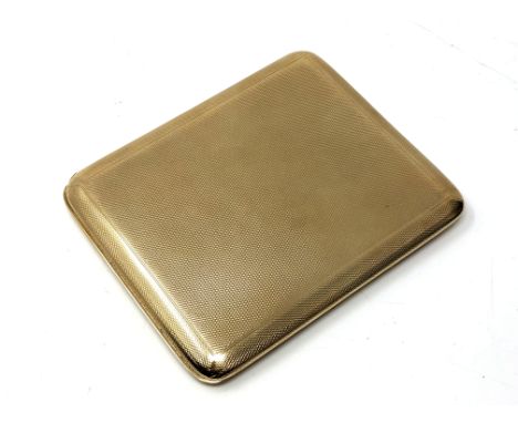 A 9ct gold cigarette case with engine turned decoration, London marks, maker's mark rubbed, 10.5cm by 8.5cm.  CONDITION REPOR