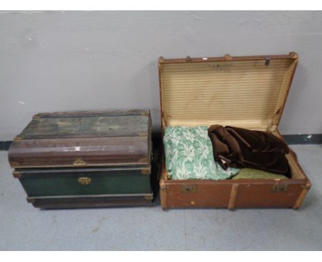 An early 20th century tin trunk together with a further wooden bound trunk 