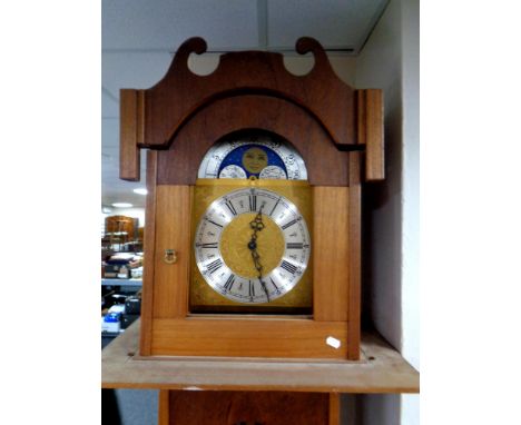 A continental longcase clock with moonphase dial