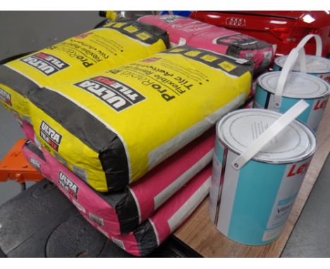 20 kg bags of Ultra Tile Fix adhesive together with three tins of Leyland Trade wall and ceiling paint 