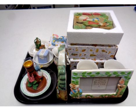 A tray of a collection of Beatrix Potter nursery china : Royal Albert milk jug, basin, Border Fine Arts photo frame, World of