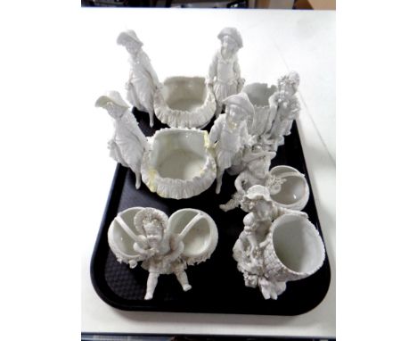 A tray of three pairs of continental ceramic cherub ornaments. 