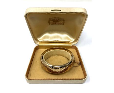 A 9ct gold bangle, weight 26.1 grams  