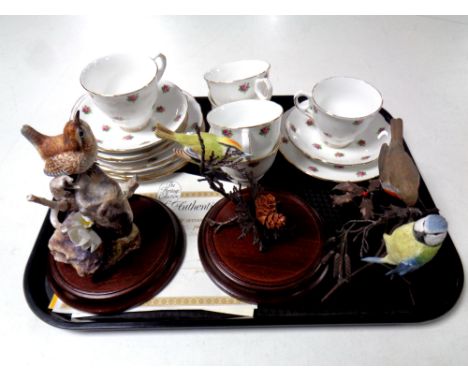 A tray of seventeen pieces of pink rose pattern bone tea china and four ceramic bird figures with certificates 