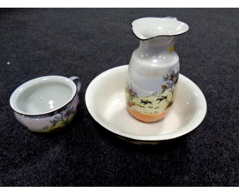 A three piece 19th century lustre wash set depicting hunting scenes. 