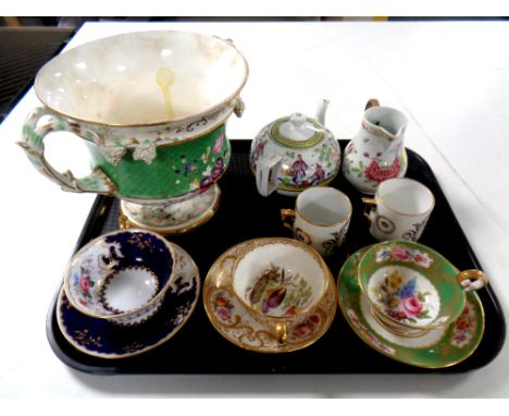 A tray of antique ceramics to include two hand painted teacups with saucers, 19th century porcelain bamboo handled milk jug e