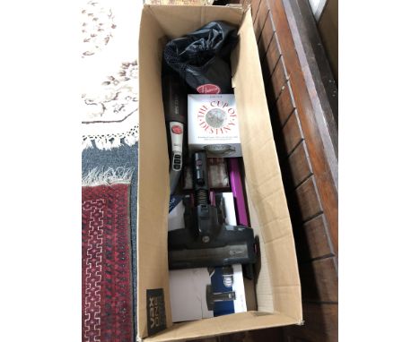 A hoover cordless vacuum cleaner with charger and accessories together with hand warmers, fortune telling cup etc 