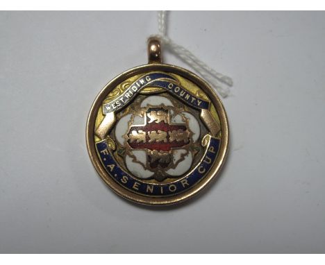 Medal, West Riding County F.A. Senior Cup Medal, in 9ct gold and enamel, bearing hallmarks for Birmingham 1925.